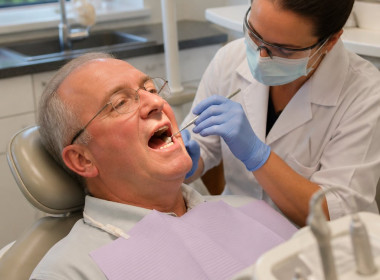 Man getting a routine filling at the dentist, completely ordinary scene