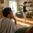 Young girl dancing in a sunlit studio with dramatic shadows.